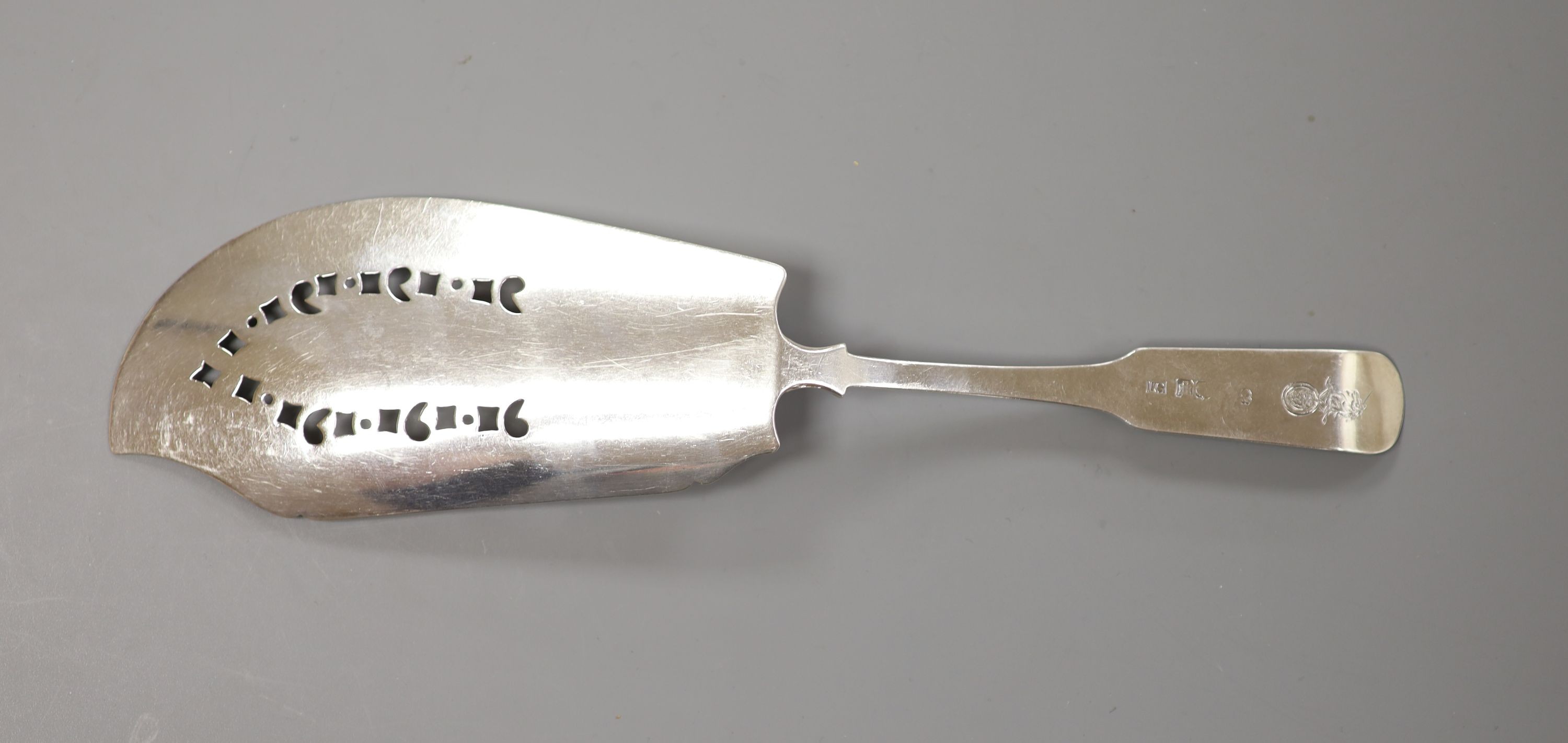 A George III Scottish silver fiddle and shell pattern fish slice, John Graham, Edinburgh, c. 1806 (marks rubbed), 30cm, 139 grams.